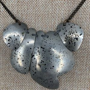 one of a kind brass metal base necklace in silver